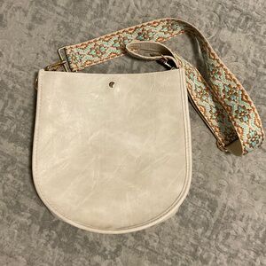 Ahdorned double entry U Shaped Crossbody Bag.